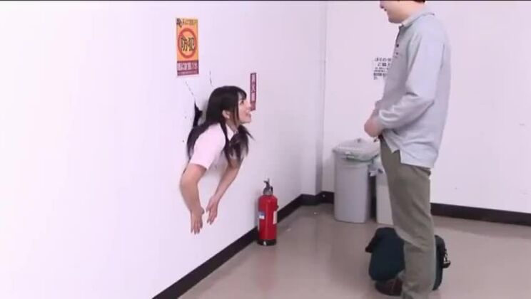 Young Japanese woman stuck inside a wall